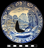 Pearlware saucer underglaze printed in medium blue. Continuous repeating floral border. One of two matching saucer from this assemblage. 5.00” rim diameter, 1.00” vessel height.